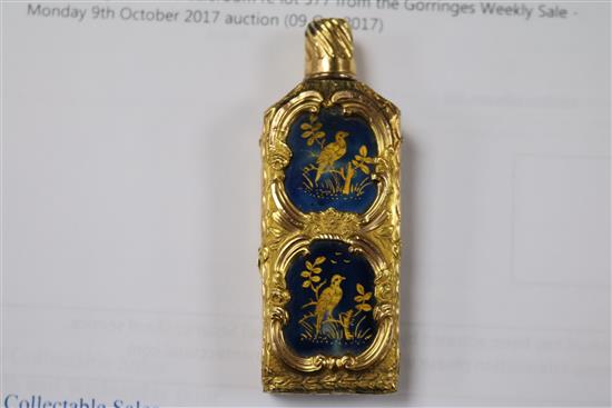 An early 20th century continental gold overlaid enamelled glass scent bottle, 75mm.